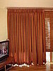Living room (After):  Draperies and woven wood shade with decorative traverse rod.  East Hampton, NY